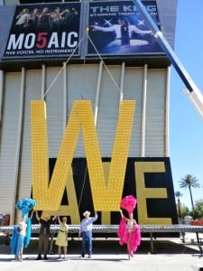 Westgate Resorts founder and CEO David Siegel, Clark County Commissioner Chris Giunchigliani and LVCVA Chairman Tom Collins ceremoniously lift "W" letter.